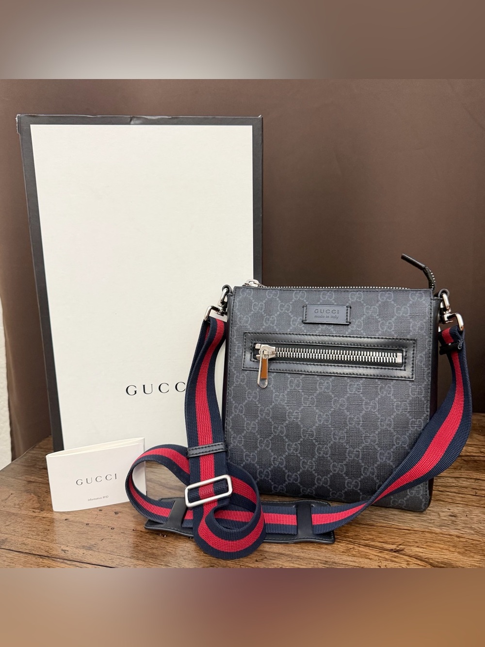 Gucci Unisex Black GG Supreme Messenger Bag with Navy & Red Strap